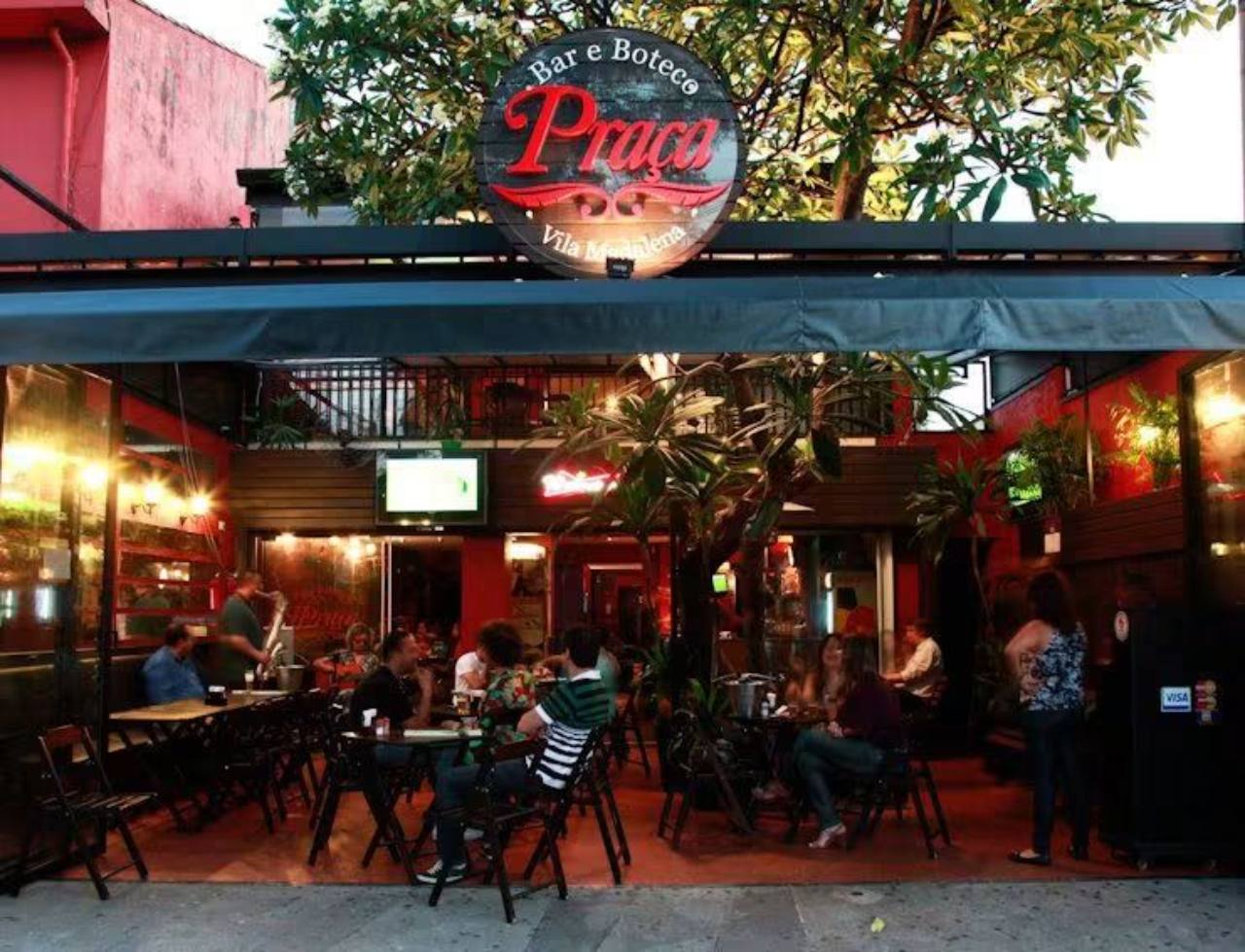 The façade and original Bar Praça sign in Vila Madalena.